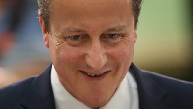 Prime Minister David Cameron is all smiles as he arrives at his constituency election count in Witney, England. 
