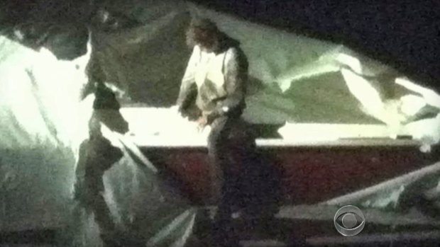 CBS News footage shows Dzhokhar Tsarnaev, later charged with the Boston bombing, being captured after hiding out in a boat. 