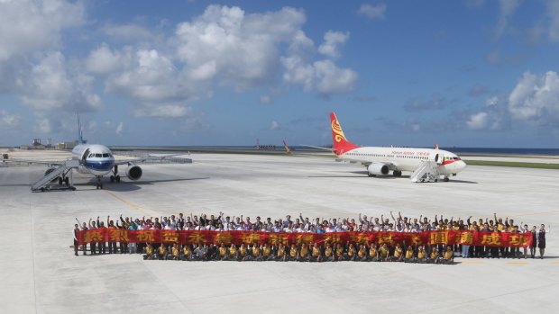 Two Chinese passenger jets land on Fiery Cross Reef in the Spratly Islands in the South China Sea in January in a test to see whether its airstrip was up to standard. .