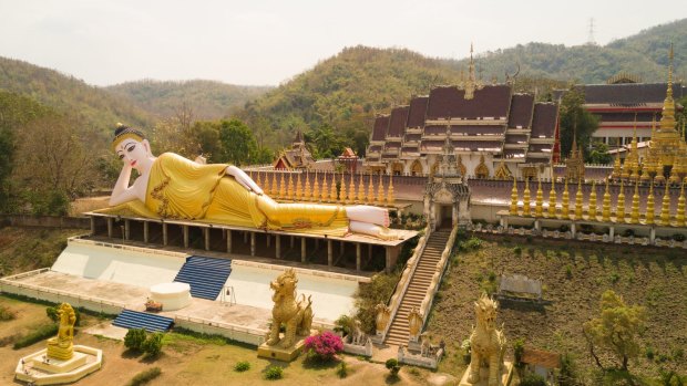 Suthon Mongkol Khiri temple and reclining Buddha, Phrae, Thailand. Photo: ShutterstockWith its ancient wall and profusion of temples, Phrae is sometimes compared to Chiang Mai or Luang Prabang, but happily devoid of tourists. Granted, there's not a lot to do here, but for a taste of "real" Thailand, it's a charming provincial city to while away time. The old town, best explored on foot or bicycle rickshaw, features some of the most impressive teak mansions in Thailand, harking back to Phrae's glory days as the headquarters for the East India Company.