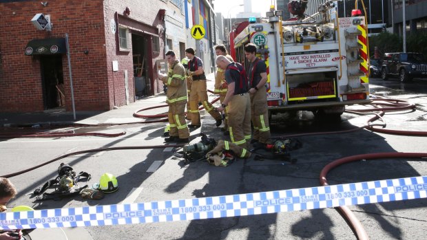 Police and firefighters at a business in Southbank, Melbourne.