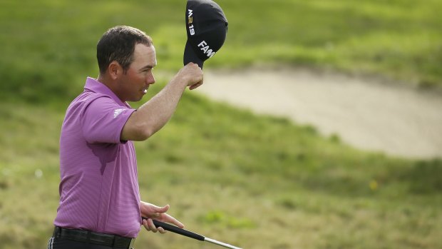 Chez Reavie tips his cap after finishing play on the 18th.