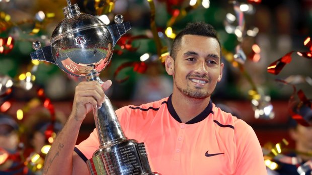 Nick Kyrgios with his third tour trophy of the year in Japan.