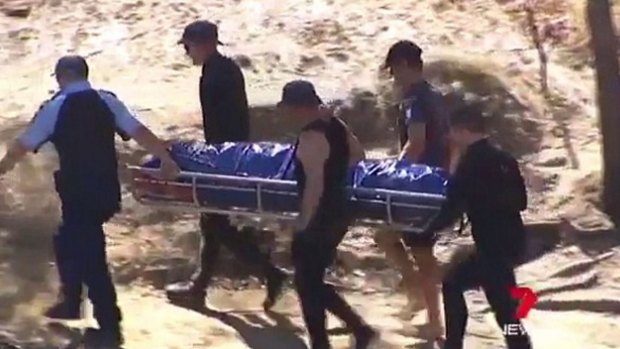 The five-year-old's body is removed from the Murray River on Saturday.