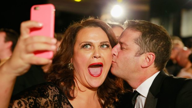 Selfie time ... Karl Stefanovic kisses Chrissie Swan as she takes a selfie at the Logie Awards in May.