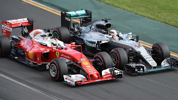 Ferrari driver Sebastian Vettel, left, of Germany and Mercedes driver Lewis Hamilton of Britain race side by side during the Australian Formula One Grand Prix at Albert Park in Melbourne in 2016.