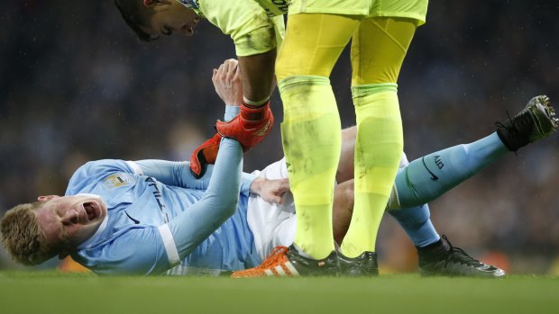 Massive blow: Manchester City's Kevin De Bruyne feels the pain.