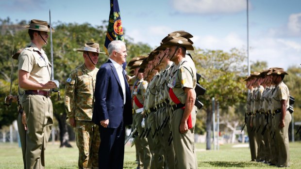 The Prime Minister toured the barracks in the seat of Herbert, while down the road Labor and coalition members were scrutinising a vote recount in the final federal seat to be determined. 