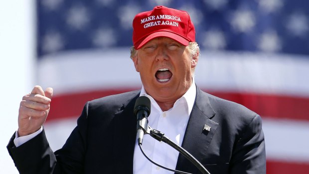 Donald Trump on the campaign trail in one of the signature baseball caps. 