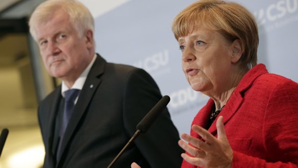German Chancellor Angela Merkel, right, and the Governor of the State of Bavaria, Horst Seehofer.