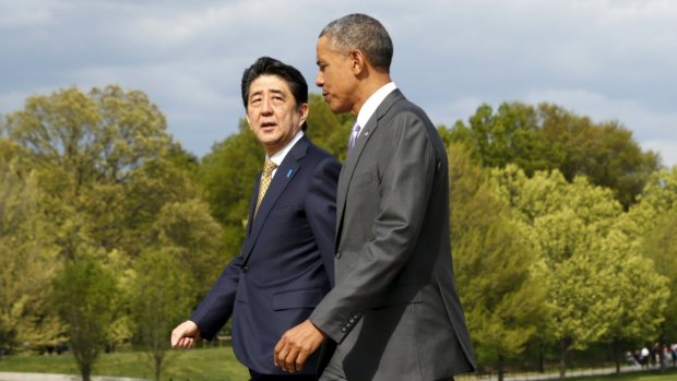 US President Barack Obama, right, and Japanese Prime Minister Shinzo Abe deep in conversation on Monday. 