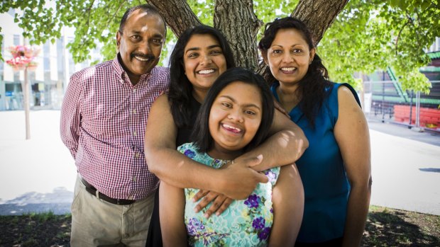 2014 Young Canberra Citizen of the Year Nipuni Wijewickrema, hugging her 15-year-old sister Gayana, and with her proud dad Ranjith, and stepmother Geetha.