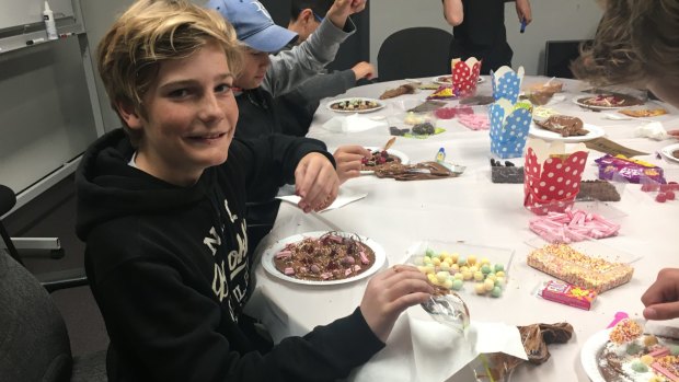 Sweet treat: Campbell Findlay indulges in the family tradition and celebrates his 12th birthday with a group of mates at his family's lolly company, Fyna Foods, maker of Wizz Fizz.