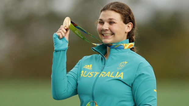 Catherine Skinner shows off her gold medal.