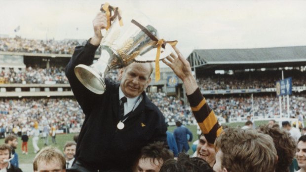 Premiership coach Allan Jeans holds up the cup.