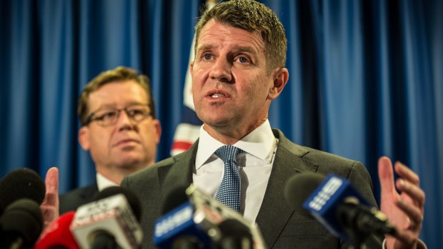 'I got it wrong': Premier Mike Baird with Deputy Premier Troy Grant at the press conference on Tuesday. 