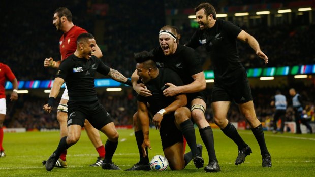 Total domination:  New Zealand players celebrate with try scorer Julian Savea.