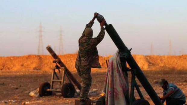An image from a Facebook page affiliated with Islamic State shows militants preparing to fire a mortar.