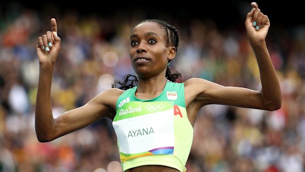 Almaz Ayana of Ethiopia crosses the finish line.