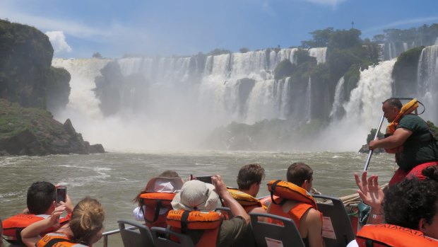 A boat trip takes visitors into the pounding heart of the Iguazu Falls.