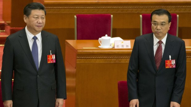 Chinese President Xi Jinping, left, and Chinese Premier Li Keqiang arrive for the opening session of the annual National People's Congress on Saturday. 