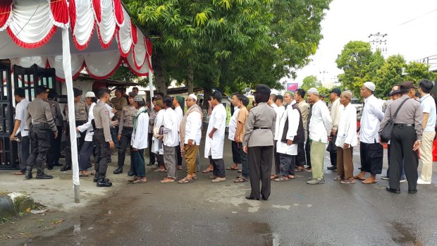 A queue outside Abu Bakar Bashir's trial on Tuesday.