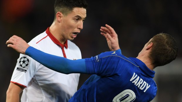 Shocked: Samir Nasri of Sevilla and Jamie Vardy of Leicester City clash.