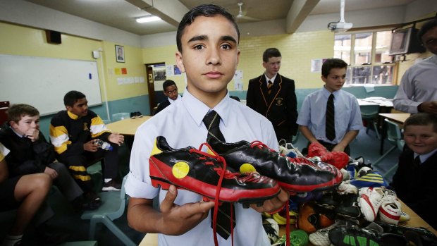 Helping out: Logan Aldridge,13, is donating his boots.