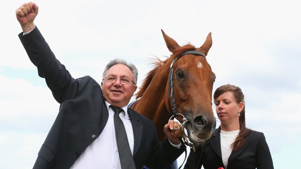 Happy days: Trainer Paul Beshara salutes Happy Trails' thrilling win in the Mackinnon Stakes last year.