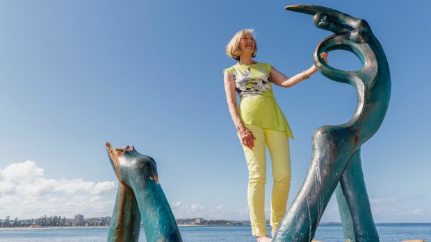 Sculptor Helen Leete stands next to the damaged 'Oceanides' statue at Fairy Bower pool, Manly.