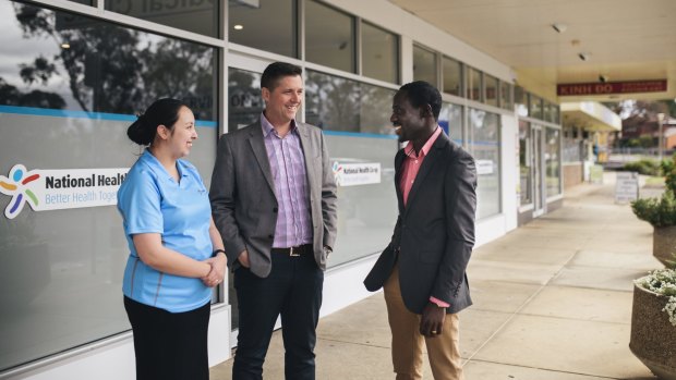 Nurse Kieth Ancheta, left, director Adrian Watts and medical director Joe Oguns outside the National Health Co-op medical clinic in Macquarie. 
