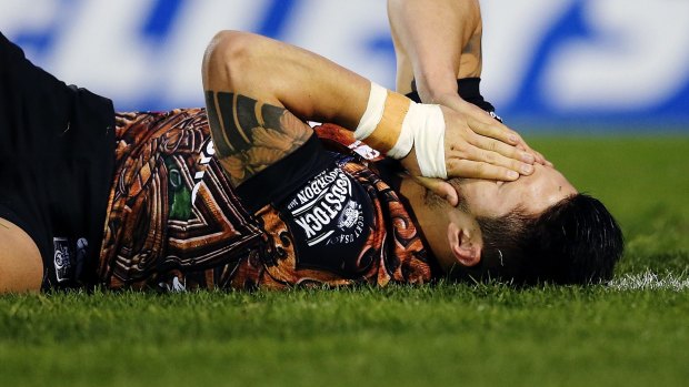 Oh no: Shaun Johnson of the Warriors reacts after suffering his season-ending injury in Auckland in July.