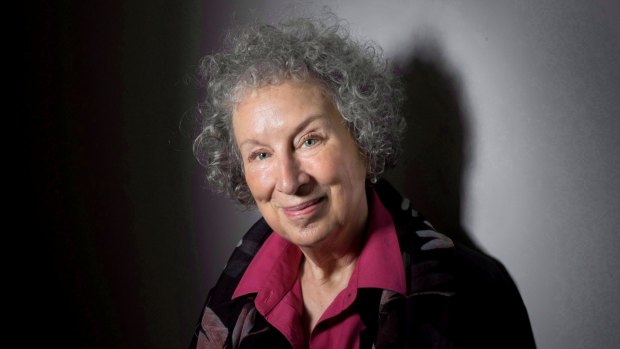FILE - In this June 9, 2015 file photo, author Margaret Atwood poses to promote her novel, "The Heart Goes Last" in Toronto. Atwood, marvels at how her 1985 novel, ?The Handmaid?s Tale,? has not only been given renewed life as a TV series but has also gained disturbing urgency. (Darren Calabrese/The Canadian Press via AP, File)
