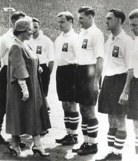 Meeting royalty: Joe Marston, the first Australian to play professionally in the UK, being presented to the Queen Mother in 1954 at Wembley. 