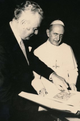 Gough Whitlam points at a book he gave to Pope Paul VI in 1973.