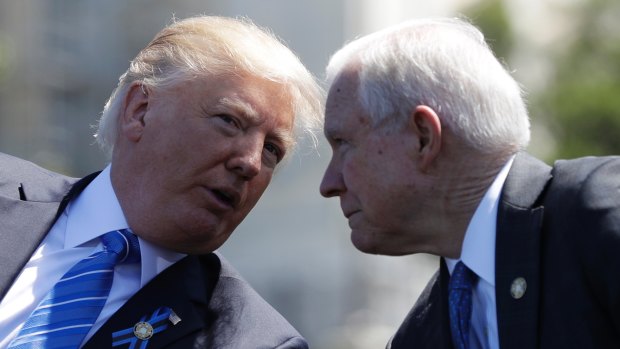 President Donald Trump talks with Mr Sessions last month.