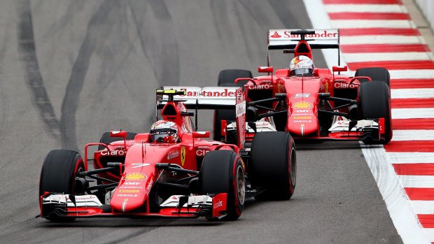 Out in front: Kimi Raikkonen rounds a bend in front of Ferrari teammate Sebastian Vettel in Sochi.