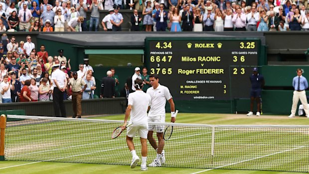 Federer congratulates Raonic.