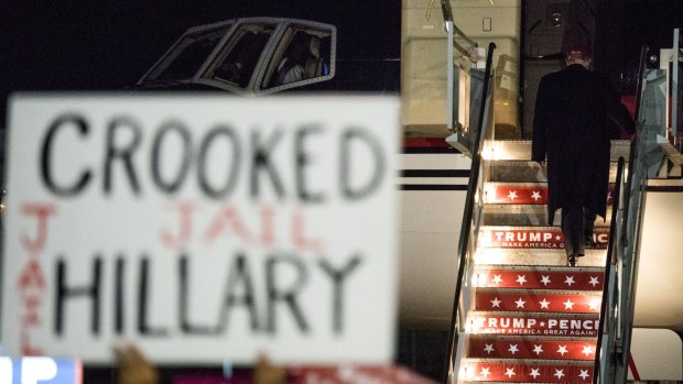 Republican presidential nominee Donald Trump boards his campaign plane   in Moon Township, Pennsylvania on Sunday night.