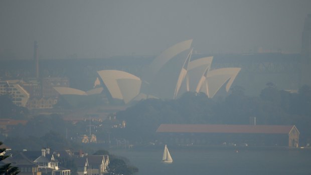 Sydney Opera house covered in haze from hazard reduction burns last May.