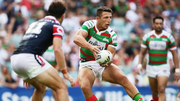 Back in the NRL: Sam Burgess passes during the round one match between the Roosters and the South Sydney Rabbitohs at Allianz Stadium.