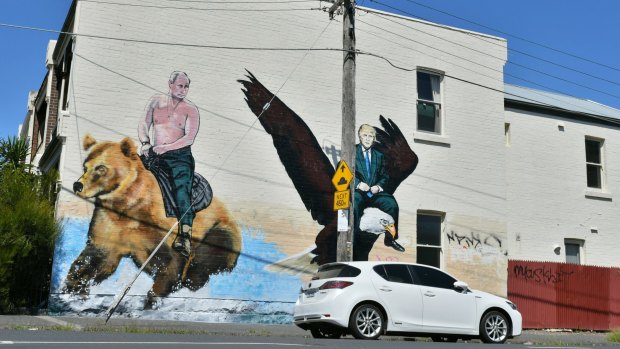 Street art in Melbourne showing US President Donald Trump riding an eagle and Russian President Vladimir Putin riding a bear.
