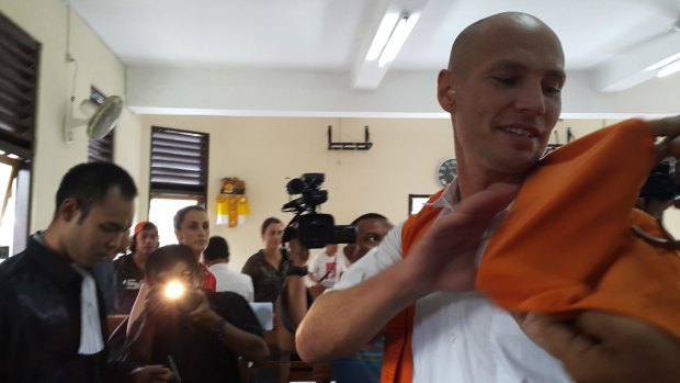 Joshua Terelinck smiles with relief after he received a light sentence for negligently causing the death of an Indonesian man in a motorcycle accident in Bali.