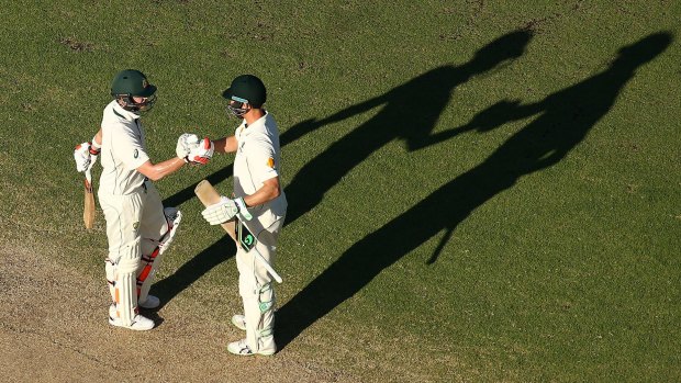 Steven Smith is congratulated by Adam Voges after scoring his century during day four of the second Test match between Australia and New Zealand at WACA.