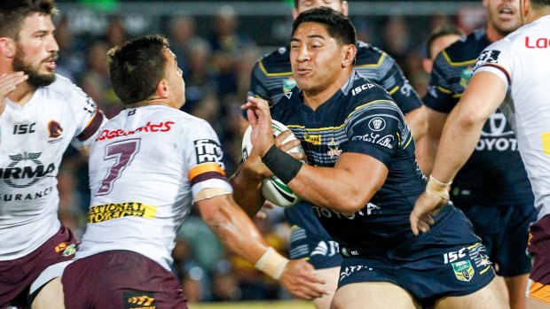 Raw force: Jason Taumalolo brings up the ball in barnstorming style.