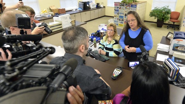 Rowan County Clerk Kim Davis, right, talks with David Moore following her office's refusal to issue marriage licences at the Rowan County Courthouse in Morehead, Kentucky, on Tuesday.