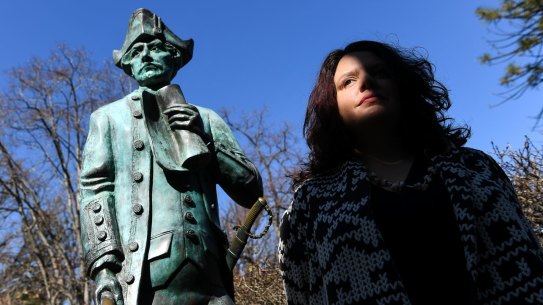 Genevieve Grieves next to the Captain James Cook statue at Cook's Cottage in Fitzroy Gardens.