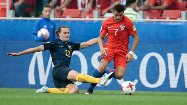 Australia's Jackson Irvine tackles Chile's Alexis Sanchez in the Confederations Cup in June.