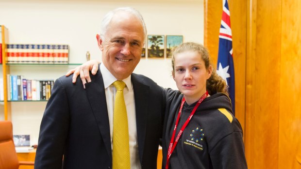 Woden Special School student Ashleigh Edwards meets Prime Minister Malcolm Turnbull after delivering his mail.