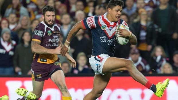 Escape act: Latrell Mitchell beats the tackle of Ben Hunt to score the match-winner.